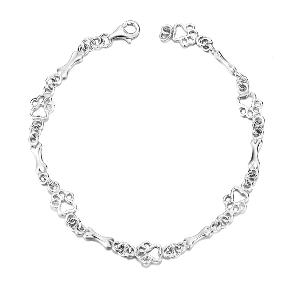 SILBERNER HUND PFOTE UND KNOCHEN CHARMS ARMBAND