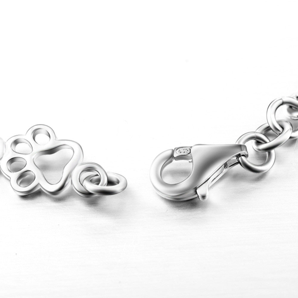 SILBERNER HUND PFOTE UND KNOCHEN CHARMS ARMBAND