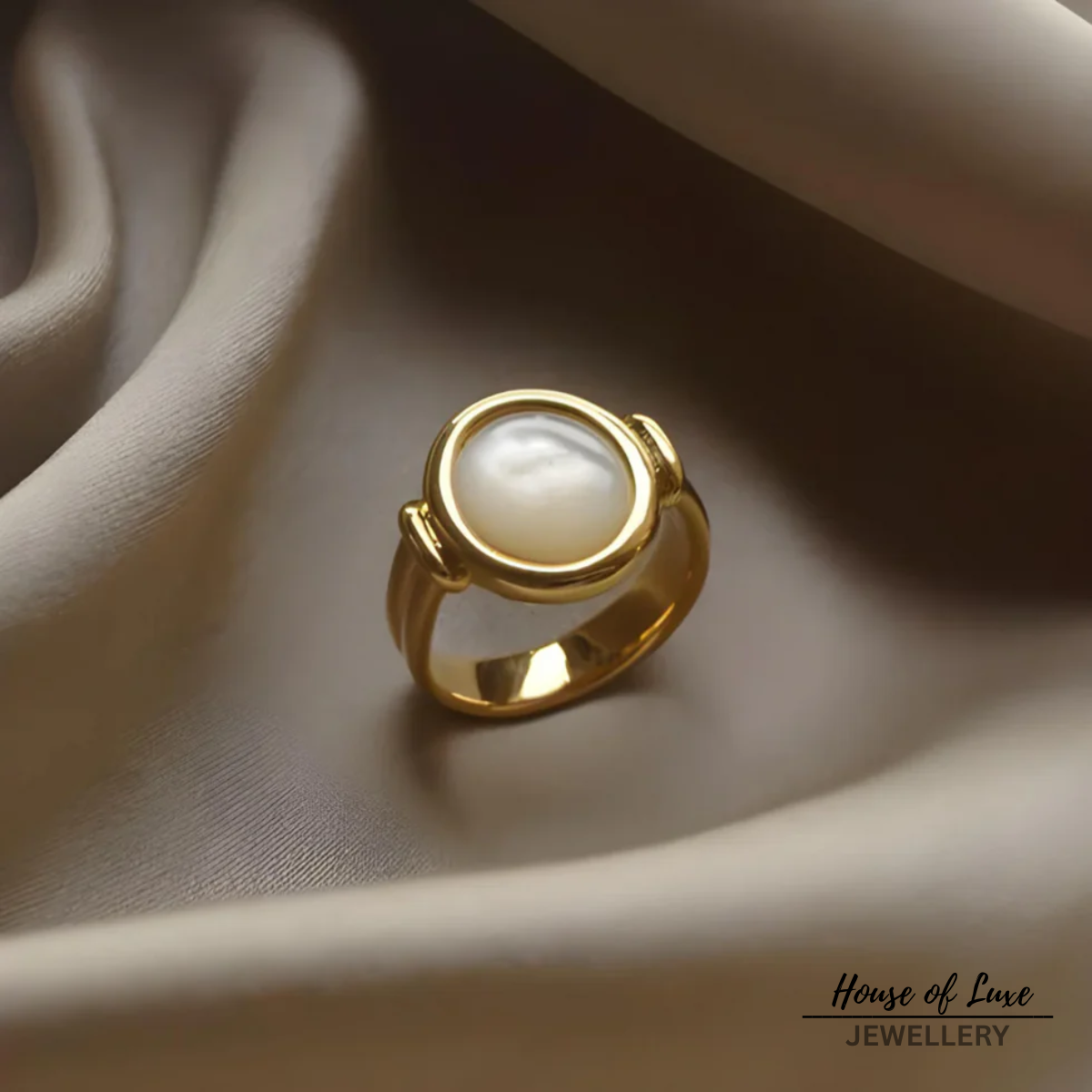 ELEGANTER RING MIT PERLEN